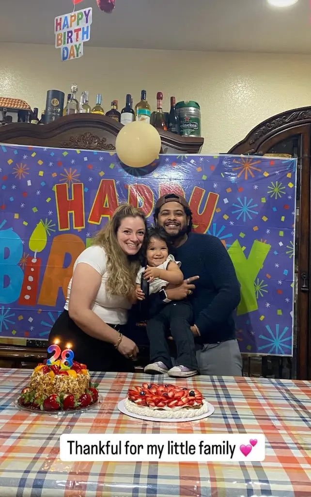 Family celebrating with a fresh strawberry pavlova cake, giving a glowing 5-star review for the best pavlova bakery near me in Miami