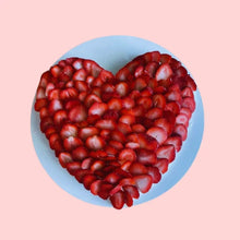 Heart pavlova cake made with fresh strawberries, arranged in a romantic shape for Valentine’s Day, anniversaries, or special occasions