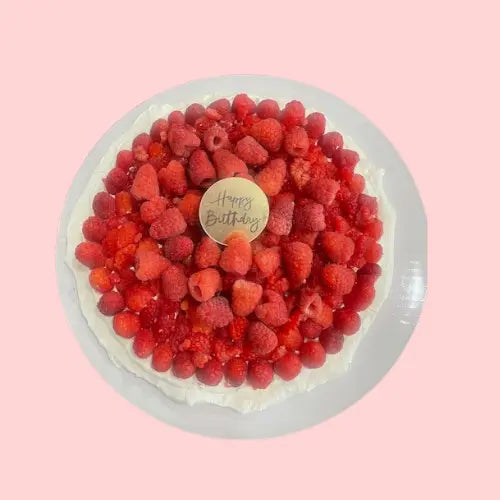Raspberry pavlova cake with whipped cream, topped with fresh berries and a Happy Birthday tag, part of the berry sweet collection by CakeMiami
