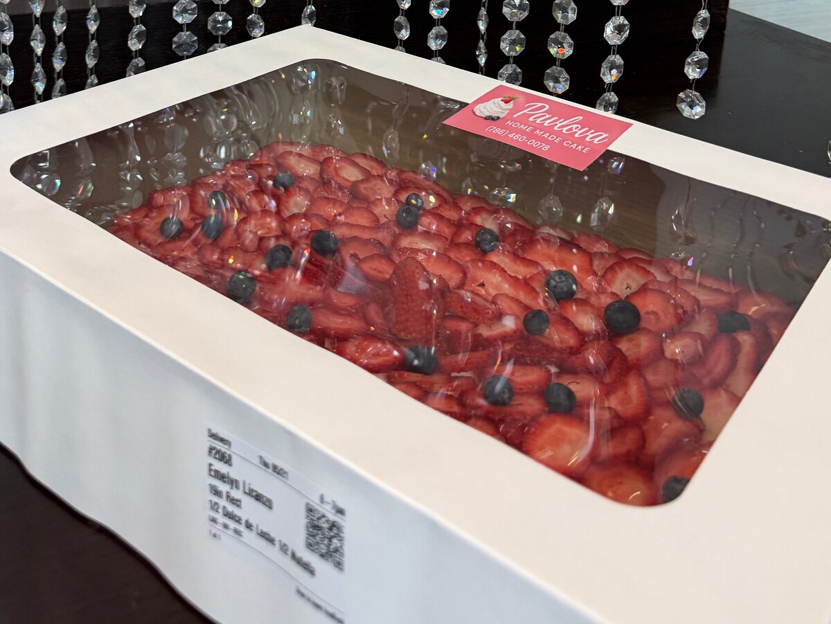 Large strawberry pavlova in a CakeMiami delivery box for Brickell